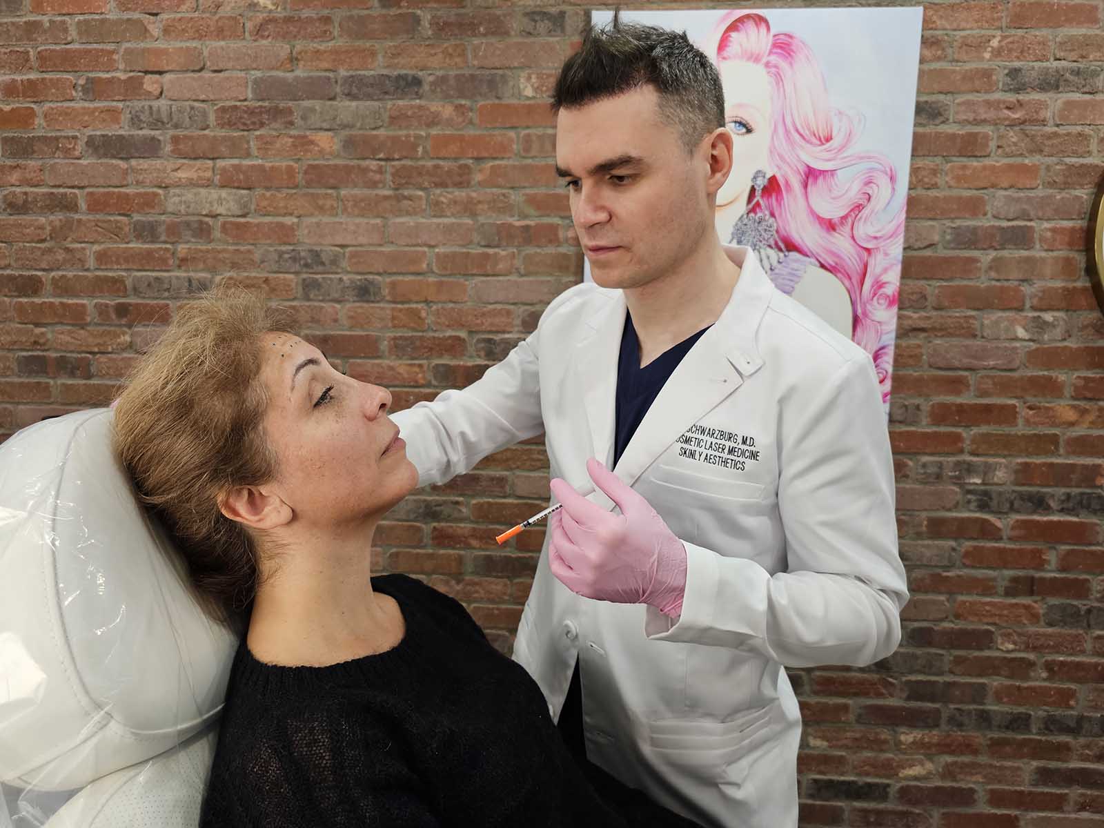 Dr. Schwarzburg provides consultation prior to treatment at Skinly Aesthetcis